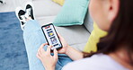 Woman, hands and browsing phone screen on homepage, website or mobile app for ecommerce on living room sofa at home. Hand of female scrolling on smartphone display of menu or catalog on lounge couch
