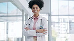 Doctor, woman and face with arms crossed in confidence for healthcare profession or career at the hospital. Portrait of confident female medical consultant expert smiling for life insurance at clinic