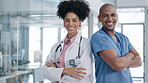 Doctor, team and face with arms crossed in confidence for healthcare profession or life insurance at the hospital. Portrait of confident man and woman medical consultant smiling in teamwork at clinic