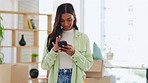 Phone texting, online conversation and woman at home with a smile from typing and social media. Web app, house packing and happiness of a young person writing a text on a cellphone feeling relax
