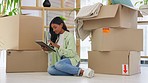 Digital tablet, boxes and woman moving to a modern house or apartment doing research for her space. Technology, relax and female planning her home on the internet with a mobile device on the floor.