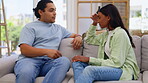 Couple, argument and conflict disagreement on sofa in living room dispute arguing at home. Angry woman and man upset in breakup, affair or relationship problems fighting on lounge couch indoors