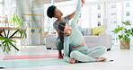 Yoga coach, women and stretching in home living room for health, wellness and fitness. Girls training, pilates and black woman or personal trainer helping female yogi with arm stretch for exercise.