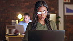 Serious, business woman and laptop at night working overtime for project deadline, design or schedule at office. Creative female employee designer working late typing on computer for startup idea