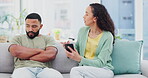 Couple, phone and argue about cheating on home sofa with problem or mistake in living room. Man and woman together on a couch for fight, crisis or divorce while reading communication on a smartphone