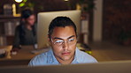 Face, computer and late with a man at work in an office for overtime on a project deadline at night. Glasses, dedication or research with an employee working on an international report in the evening