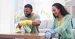 Cleaning table, home and couple with spray bottle, detergents and hygiene products for living room furniture. Relationship, housekeeping and happy man and woman wipe dust, dirt and clean together