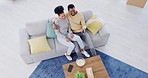 Couple, top view and living room sofa, tv or relax with popcorn for movies, video or funny comedy. Black man, woman or hug for bonding, television or happy on lounge couch with remote control in hand
