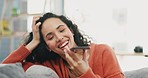 Phone call, relax and woman on a sofa in the living room on a weekend in her modern home. Happy, smile and female on a mobile conversation with a cellphone while resting in the lounge of her house.