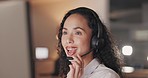 Woman, call center and consulting at night in telemarketing, customer service or support at the office. Happy and friendly female consultant agent working late with headphones and mic for online help