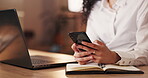 Business woman, hands and phone at night for communication, social media or chatting at the office desk. Hand of female employee working late texting or browsing on mobile smartphone at the workplace