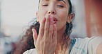 Selfie, happy and face of a woman blowing kiss for flirty communication, greeting and vlog. Smile, happiness and portrait of an influencer girl with a cute gesture while taking a photo in the city