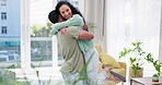 Love, hug and happy couple in home, bonding and smiling together in house living room. Care, romance or smile of man and woman hugging, cuddle or embrace with joy, having fun or enjoying quality time