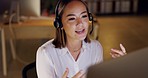 Call center, asian woman in office at night and advice at customer service agency for support and networking. Smile, overtime and happy help desk agent or crm consultant with headset on phone call.