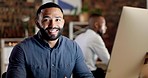 Coworking, business man and face of a happy employee at a computer for startup job. Happiness, desktop and professional worker portrait of a digital writer with a smile from company and career