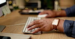 Businessman, hands and typing at night on computer keyboard for research, email or communication on office desk. Hand of employee man working late on desktop PC for schedule planning, chat or tasks