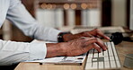 Businessman, hands and typing at night on computer for research, email or communication on office desk. Hand of employee man working late on desktop PC keyboard for schedule planning, chat or tasks