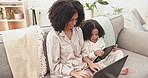 Laptop, tablet and mother with child on sofa for online learning, educational games and working on internet. Family, love and happy mom and girl with technology bonding, relax and together at home