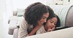 Kiss, tablet and mother with child on sofa for online learning, educational games and watching movies. Family home, love and happy mom and girl on digital tech for bonding, relax and loving together