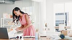 Stress, work and a woman looking for a document, report or paperwork in an office. Messy, business and a frustrated employee searching for information, notes or paper on a desk in the workplace