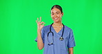 Medical, hand gesture and a nurse woman on a green screen background in studio to explain while consulting. Healthcare, perfect and diagnosis with a female medicine professional talking on chromakey