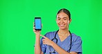 Green screen, phone and doctor point and smile for clinic website, research and mobile app mockup. Healthcare, digital and portrait of woman on smartphone for wellness, medical service and telehealth