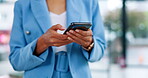 Business woman, hands and phone typing in communication, social media or chatting at the office. Hand of female employee texting, browsing or networking on mobile smartphone app at the workplace