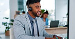 Businessman, call center and consulting with headphones on computer in customer service or support at office. Happy or friendly male consultant agent talking on headset for online advice at workplace