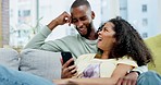 Couple, phone and laughing on sofa in home at comedy, joke or comic meme online. Interracial, cellphone and happiness of black man and woman relax on couch in lounge on social media, funny or humor.