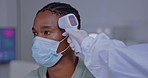 Thermometer, doctor and covid patient with a face mask in a hospital checking temperature. Medical, healthcare and wellness worker monitoring fever for corona virus in a clinic at consultation