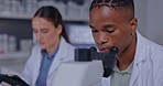 Black man, microscope analysis and test in lab for results, report and problem solving in pharma industry. Scientist, laboratory and woman with tablet for medical study, vaccine development and data