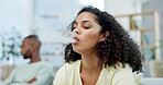 Addiction, habit and a woman smoking an e cigarette while sitting on a sofa in the living room of her home. Smoke, nicotine and lifestyle with an attractive young female smoker in her house to relax