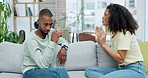 Couple, cheating and argument in home, fight or disagreement on sofa. Interracial, divorce affair and angry black man and woman shouting with conflict, frustrated or marriage problem for infidelity.