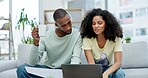 Black couple, laptop and mortgage expenses in financial planning or budgeting document together on sofa at home. African man and woman working on computer in finance paperwork or bills in living room