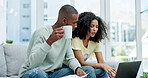 Coffee, laptop and couple with paperwork for finance, taxes or savings on sofa in home. Interracial, documents and black man and woman with computer for planning budget, insurance or financial bills