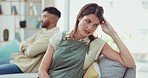 Divorce, angry and couple on couch, argument and anxiety in living room, frustrated and stress. Partnership, man and woman on sofa, mental health and depression in lounge, fight or toxic relationship