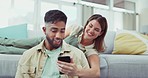 Laptop, phone and couple relax in a living room while online for property, home loan or mortgage discussion. Internet, search and man with woman browsing real estate, rental or apartment listing