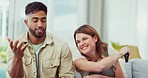 Interracial couple, watching tv or fight for remote on sofa in living room for playing, care or love. Indian man, caucasian woman or funny game for choice of television show, relax and couch in house