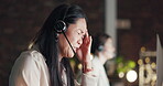 Headache, migraine pain or Asian woman in call center with burnout feeling overworked in communications. Stressed, tired or telemarketing sales agent with anxiety, fatigue or pain problem at night