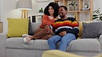 Watching tv, couple and living room sofa with young people streaming a movie at home. Lounge couch, love and happy conversation of a woman and man together enjoying a television show in a house