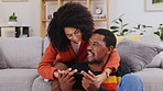 Black couple, tablet and hug relaxing by sofa for social media or streaming entertainment together at home. Happy African man and woman smiling on touchscreen for wifi, browsing or internet by couch
