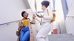Women friends, happy and walk on stairs in city for urban adventure, comic chat and happiness outdoor. Black woman, metro and walking on steps with fashion, funny conversation and support for bonding