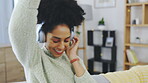 Dance, relax and music with woman on sofa for freedom, carefree and streaming. Energy, mobile radio and happy with female listening to headphones at home for audio, subscription service or connection