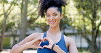 Portrait, heart and hand gesture with a fitness woman outdoor in a park for a cardio or endurance workout. Exercise, smile and emoji with an attractive young female athlete happy to be training