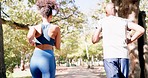 Fitness, running and black couple in park from back for exercise and bonding in nature together. Marathon training, man and woman run on garden path for health, wellness and workout with green trees.
