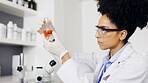 Scientist, lab and woman with chemical in beaker for research, experiment or test. Science, chemistry or female chemist or researcher shaking glass for medical study, medicine or sample in laboratory
