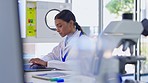 Scientist typing, woman and laptop research in a laboratory for biotechnology and medical analytics. Computer, science and biology report of a working professional female in a lab for project