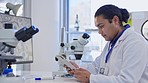 Digital tablet, microscope and scientist in lab doing pharmaceutical research on the internet. Technology, science and professional male scientific researcher working with mobile device in laboratory