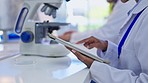 Hands, tablet and typing in laboratory for science study, schedule and planning development of pharma product. Female scientist, data analytics or medical research in lab with touchscreen ux for goal