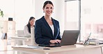 Office, laptop and face of business woman at desk working on online project, research and typing email. Corporate, manager and portrait of happy, confident and female worker with pride on computer